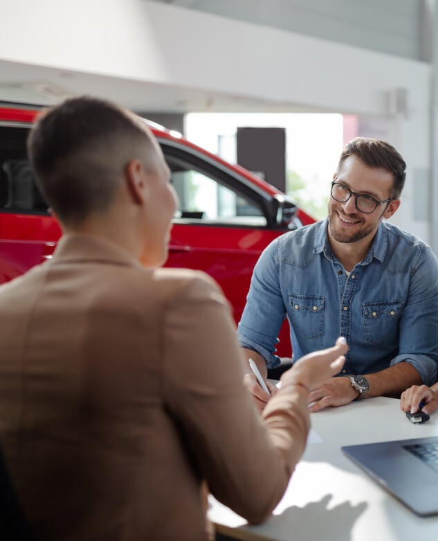 Signing contract at GMC dealership