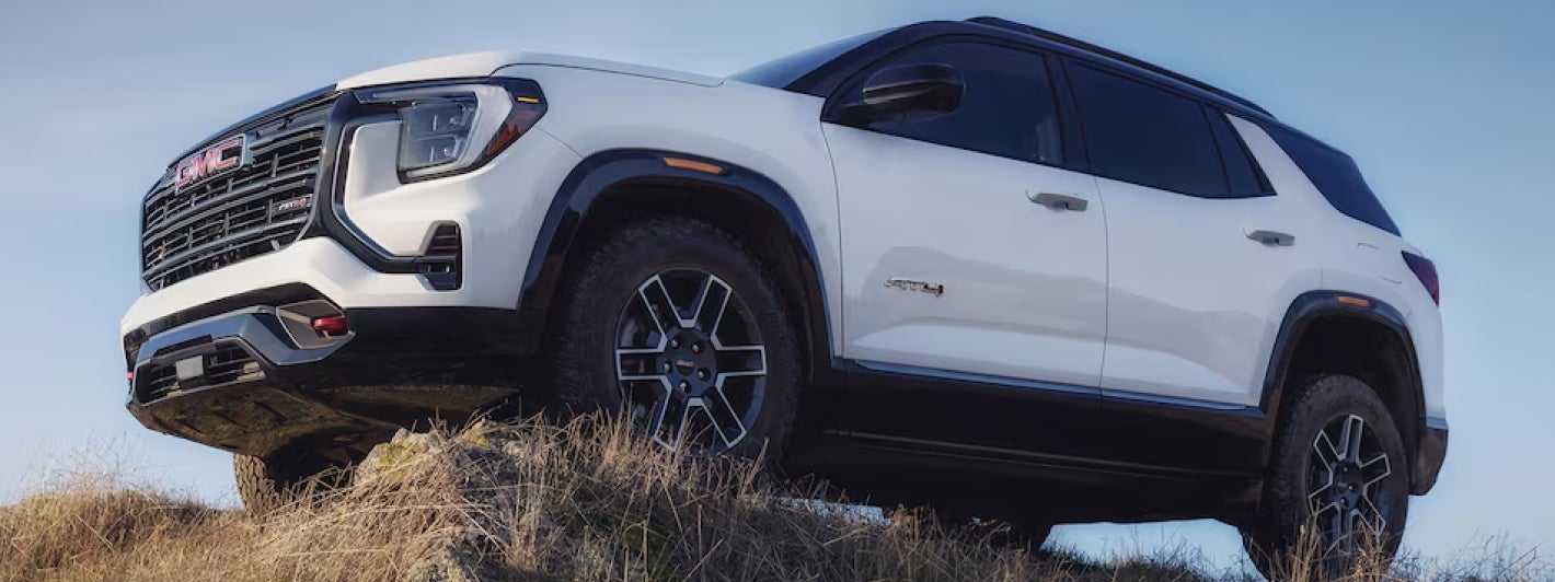 GMC Terrain in grassy rocky terrain